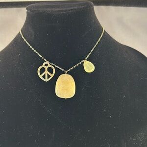 Two peace symbol necklaces